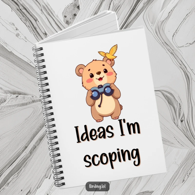 Funny bear cub with binoculars on a notebook cover, looking up with excitement, ideal for writing.